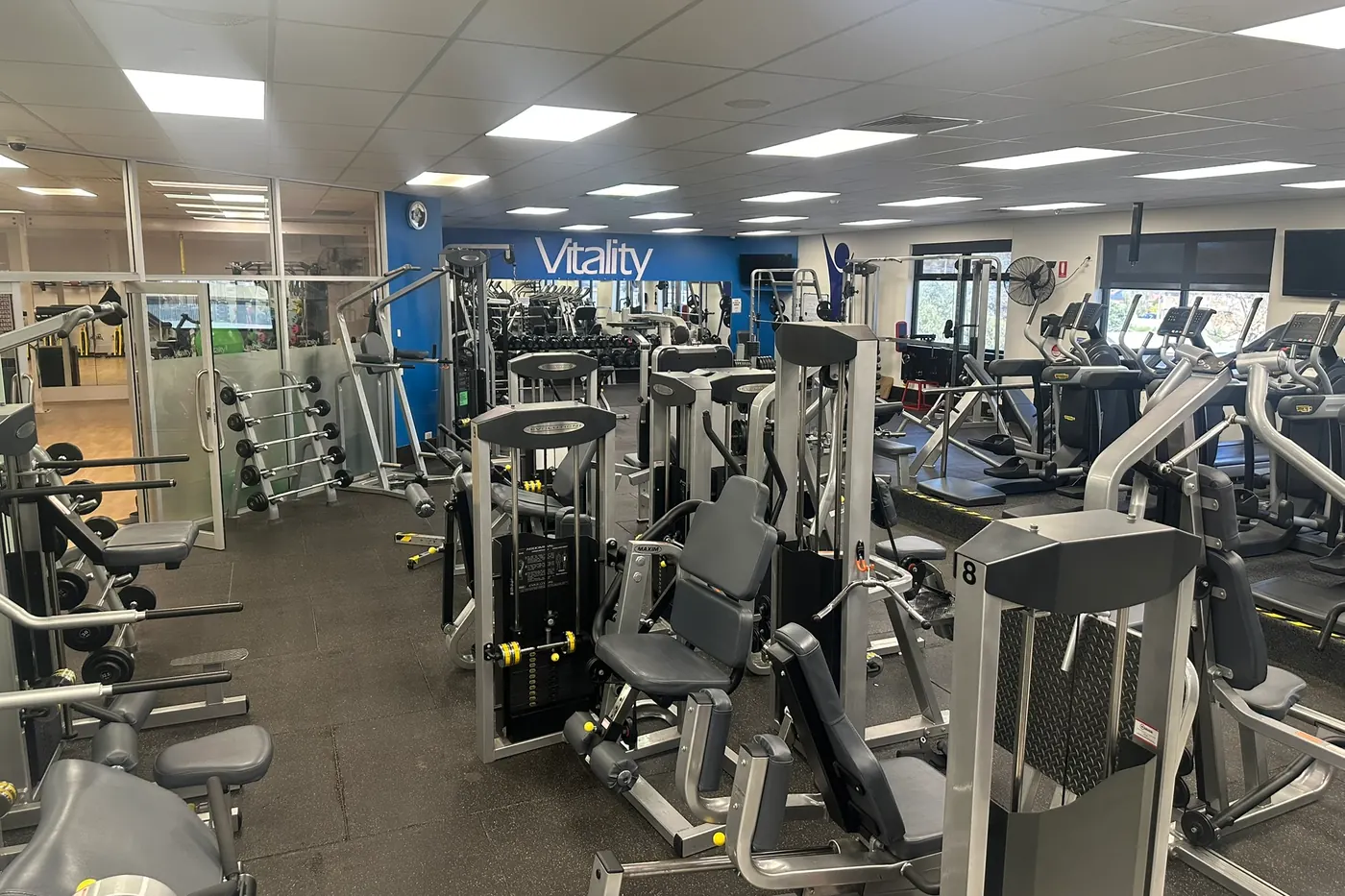 The strength floor at the Berri club, with pin-loaded machines in the foreground and the free weights and cardio areas behind